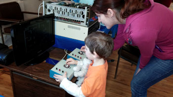 Dual Dazzlers Child playing Altair 8800b running computer tank game